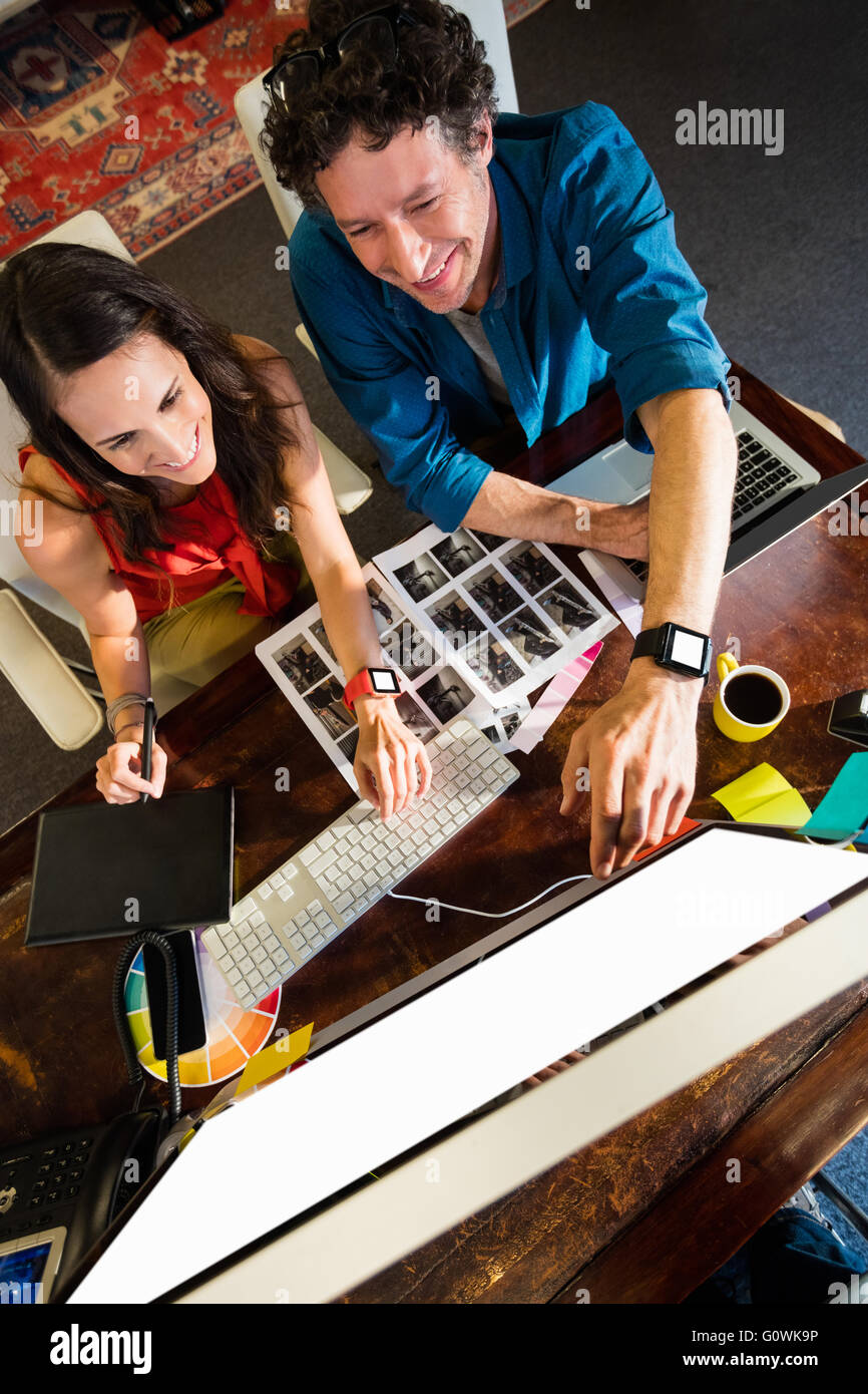 Colleagues using a graphic pad Stock Photo