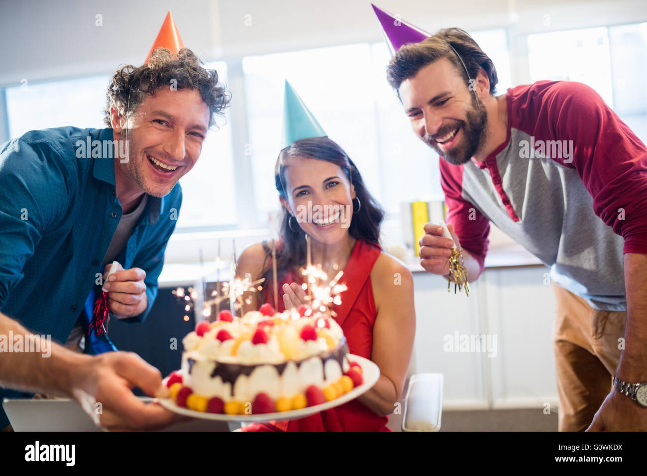 Colleagues celebrating a birthday Stock Photo - Alamy