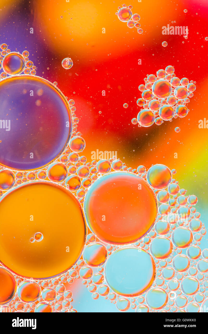 Colorful abstract macro background with oil drops in water Stock Photo