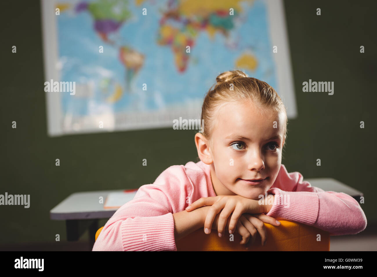Girl leaning against chair Stock Photo Alamy