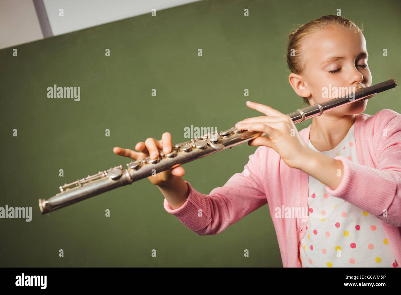 Girl playing the flute Stock Photo Alamy