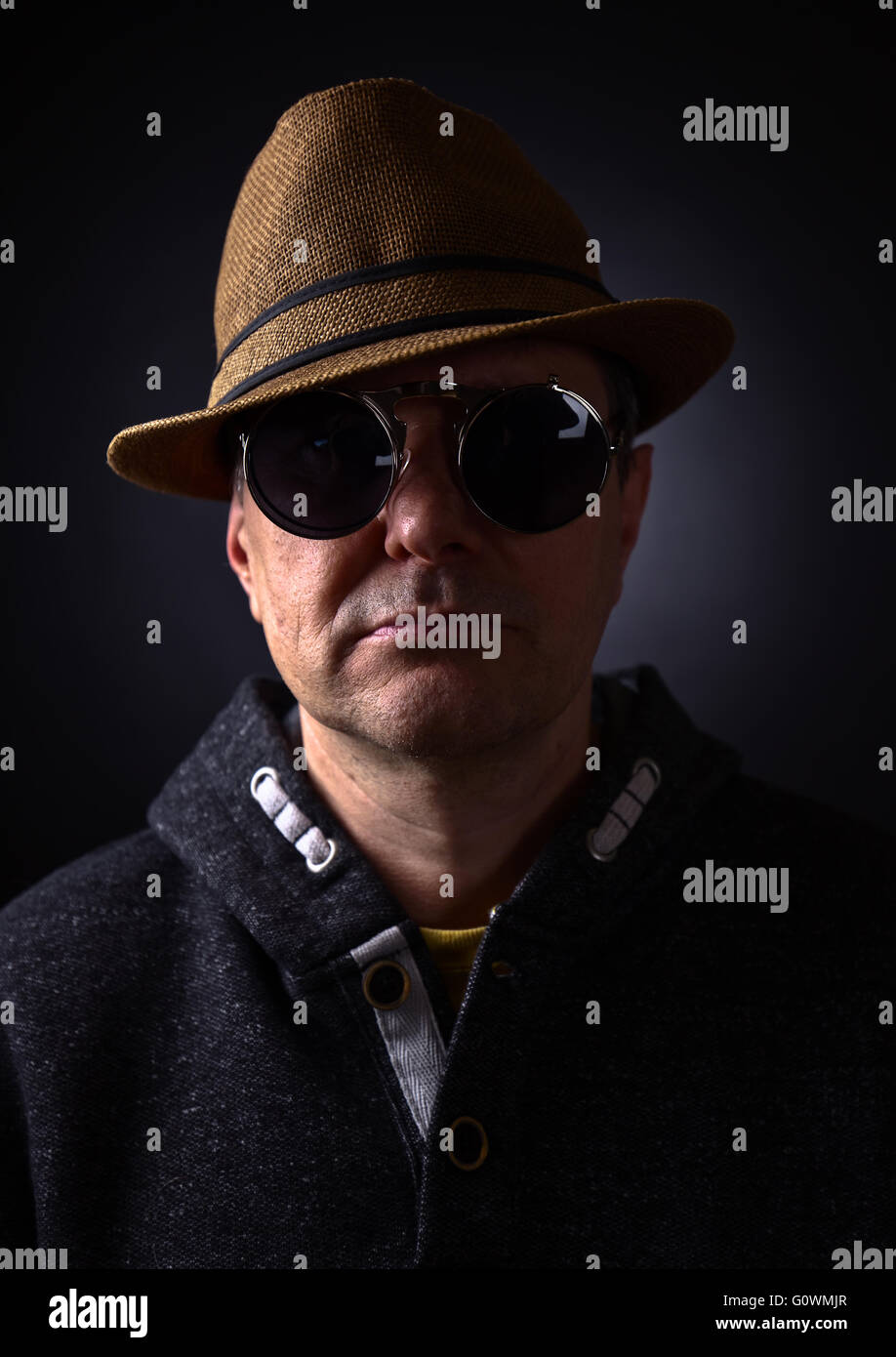 Portrait of a man in hat , studio shot Stock Photo - Alamy