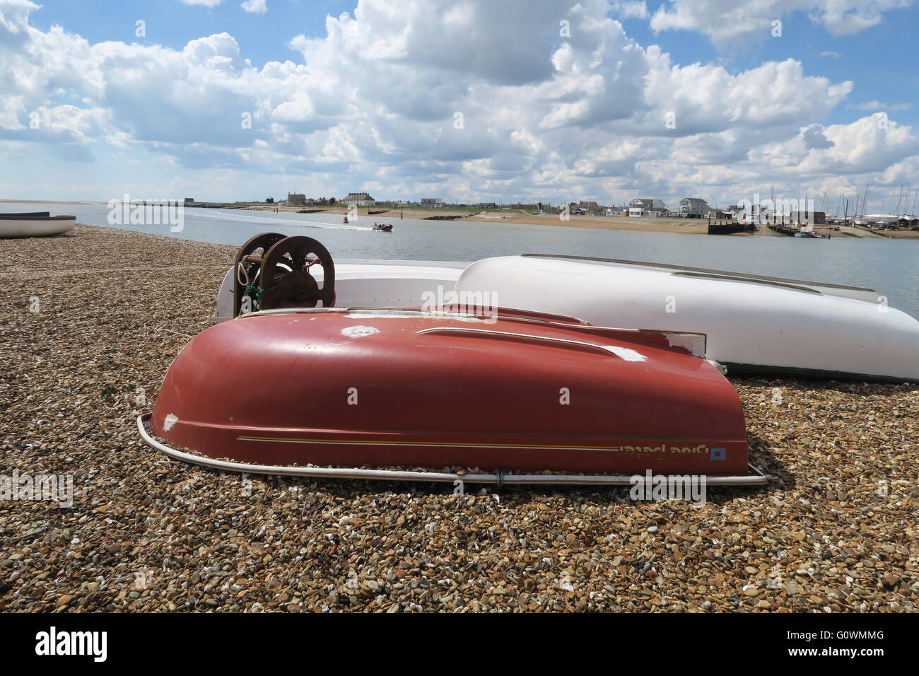 Upturned boats on Bawdsey Beach, Suffolk Stock Photo