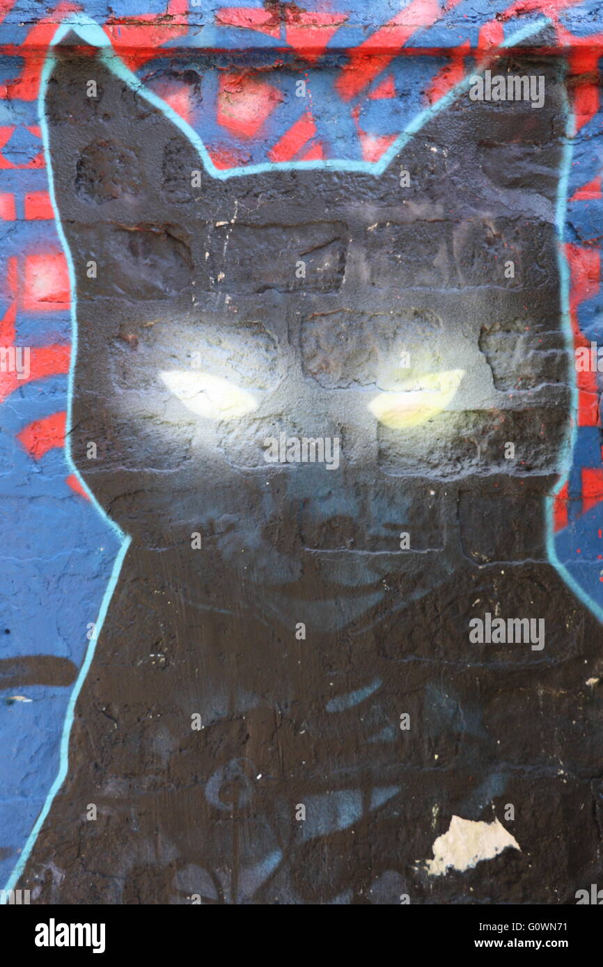 Street Art in Paris representing a black cat Stock Photo - Alamy