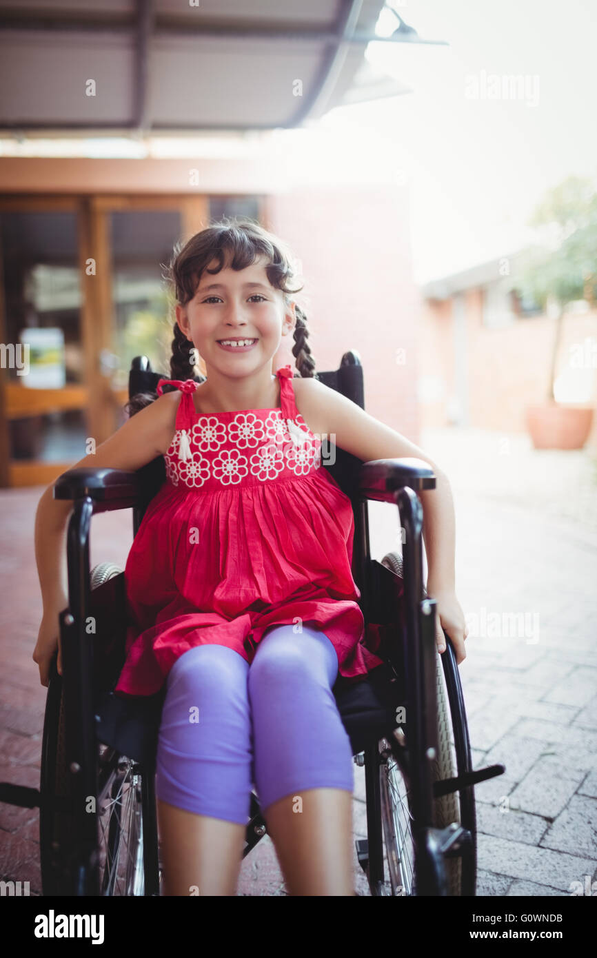 Smiling girl siting in a wheelchair Stock Photo - Alamy