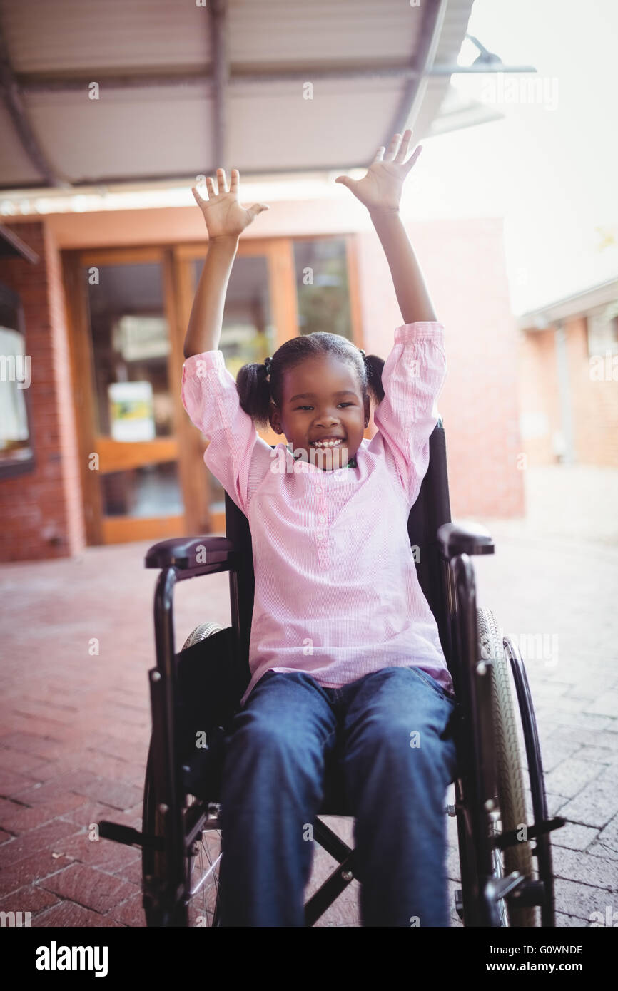 Smiling girl siting in a wheelchair Stock Photo