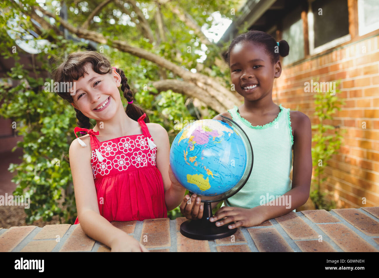 Smiling girl looking at the camera Stock Photo - Alamy