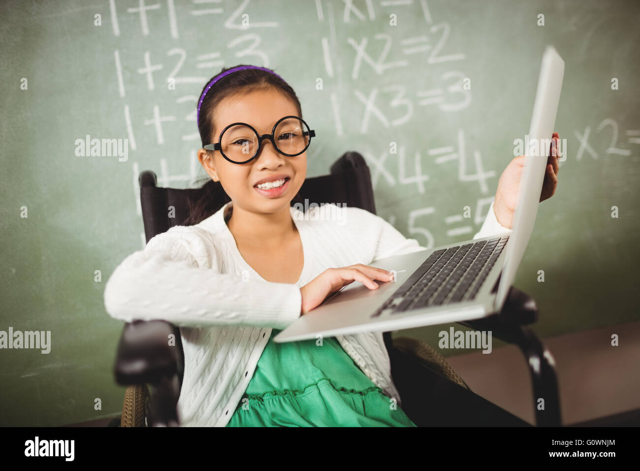 Cute girl with big glasses looking at the camera Stock Photo