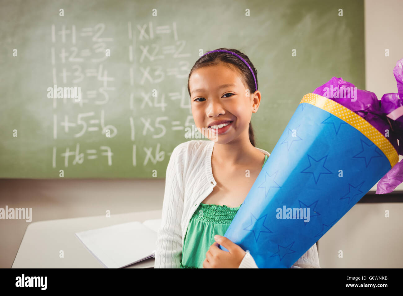 Smiling girl looking at the camera Stock Photo - Alamy