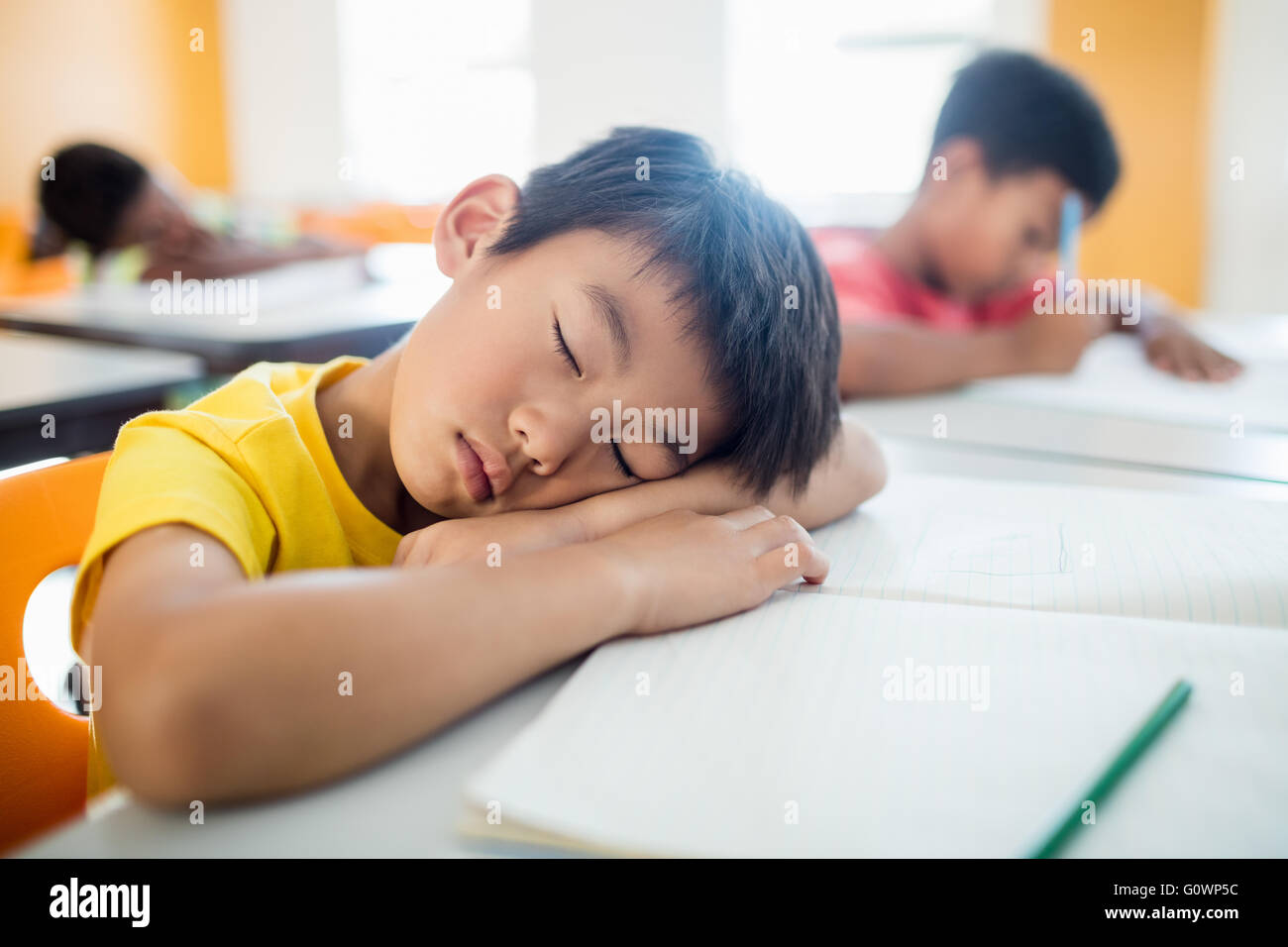 Portrait of pupil falling asleep Stock Photo