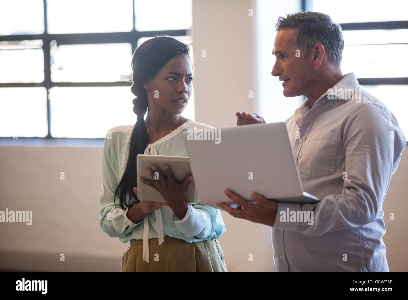 Two business people having a discussion Stock Photo