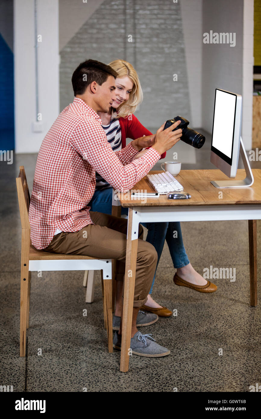 Team of photographers working at desk Stock Photo