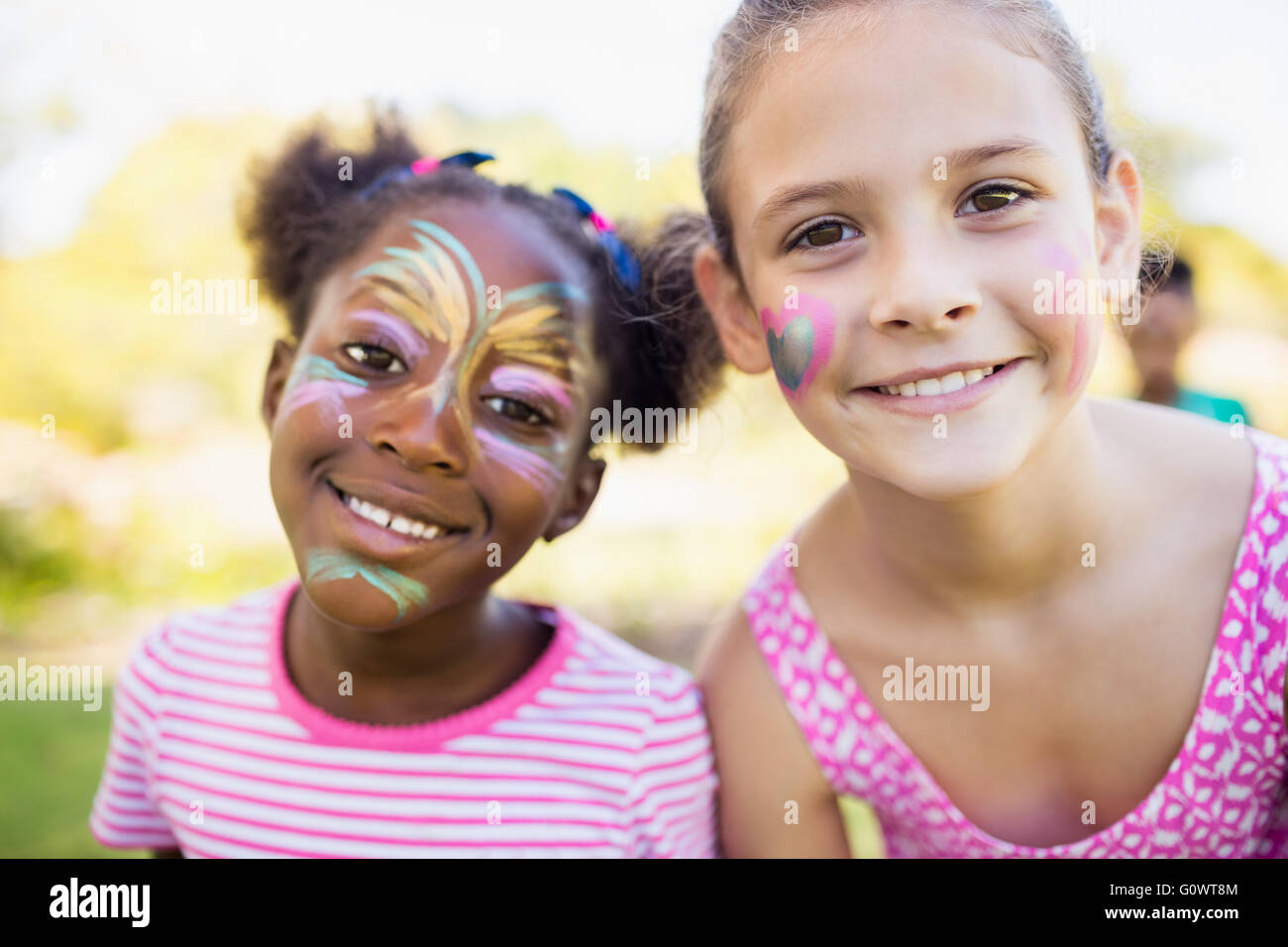 Portrait of two cute girls with make up on the face Stock Photo