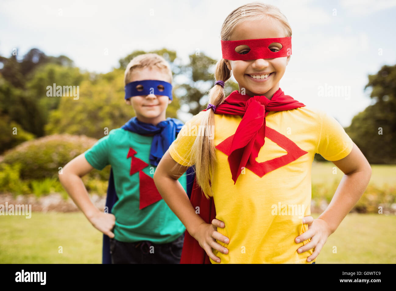 Cute children posing with hands on hips Stock Photo Alamy
