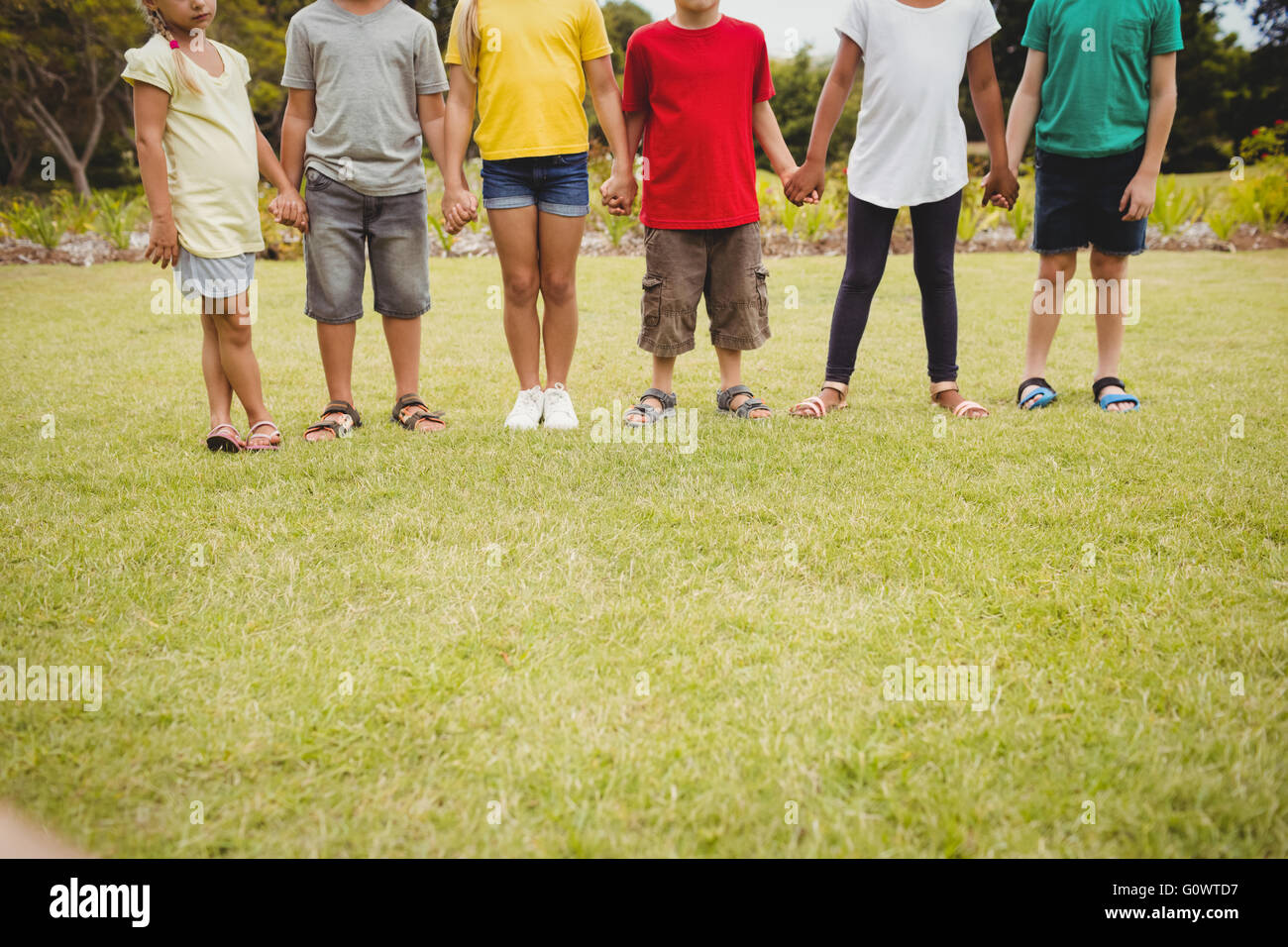 Children holding hands hi-res stock photography and images - Alamy
