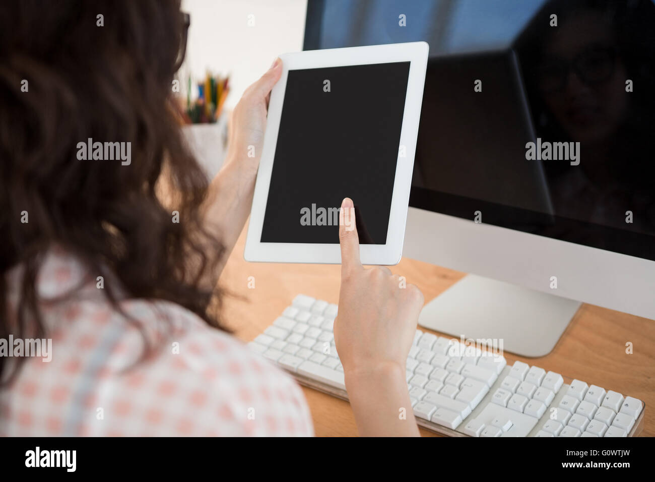 A business woman is using a touchpad Stock Photo