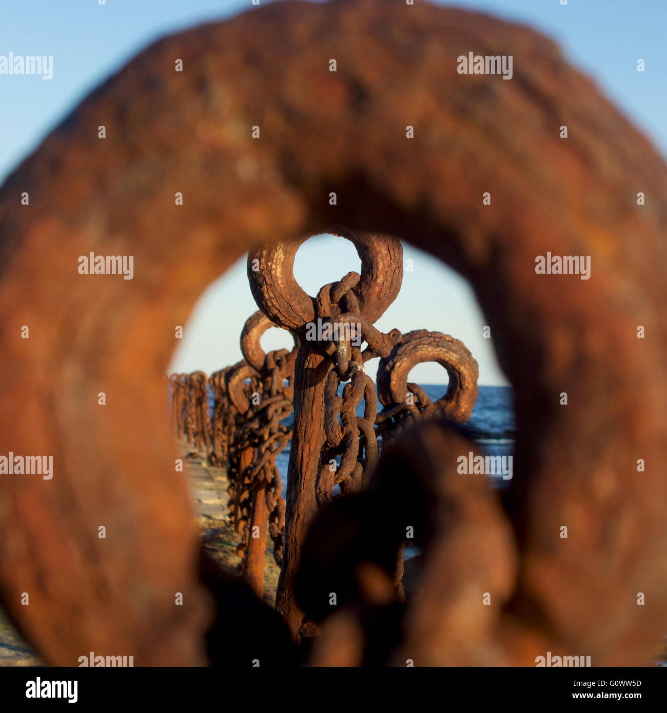 Rusty posts and chain beside the salt water baths, Newcastle, NSW