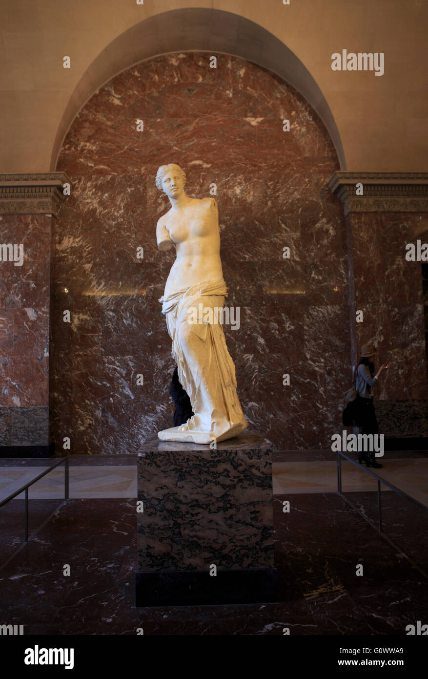 The Venus de Milo is an ancient Greek sculpture on display at The Louvre in Paris, France Stock