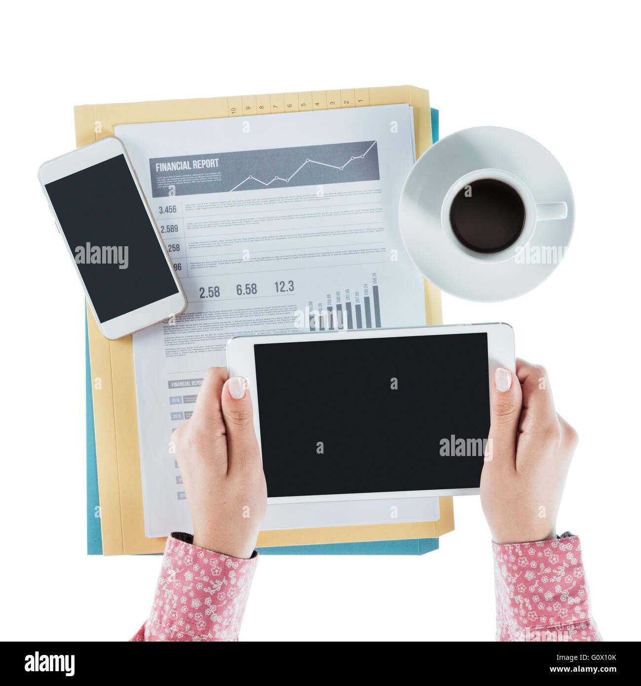 Business woman working at desk and using a digital tablet, hands close up, top view Stock Photo