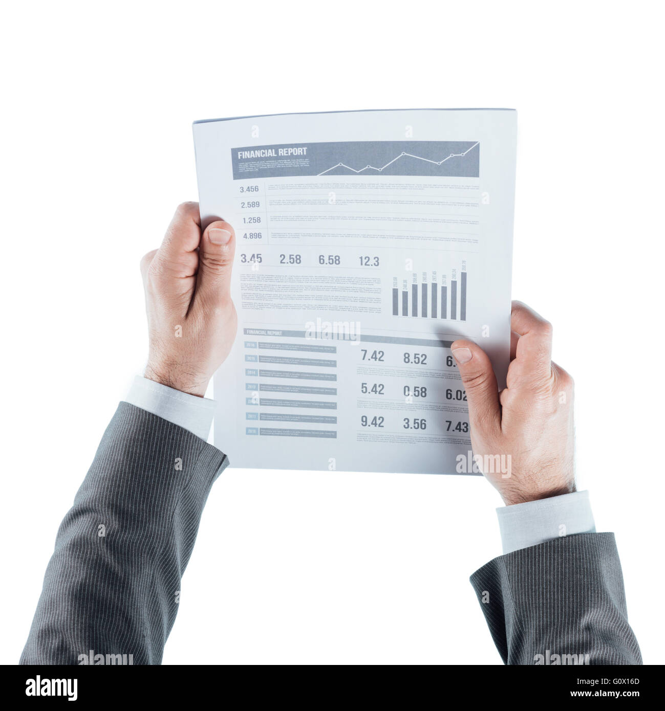 Businessman holding a financial report and checking data on white background, hands close up Stock Photo
