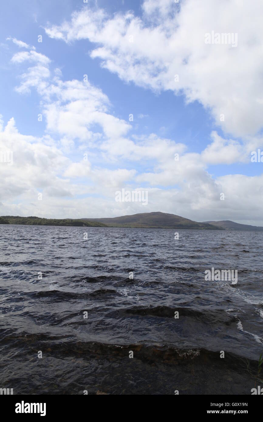 Seascape with island, blue sky and clouds Stock Photo - Alamy