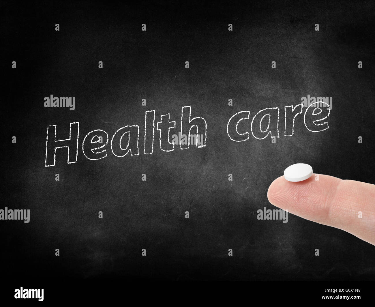 Health care written on a blackboard Stock Photo Alamy