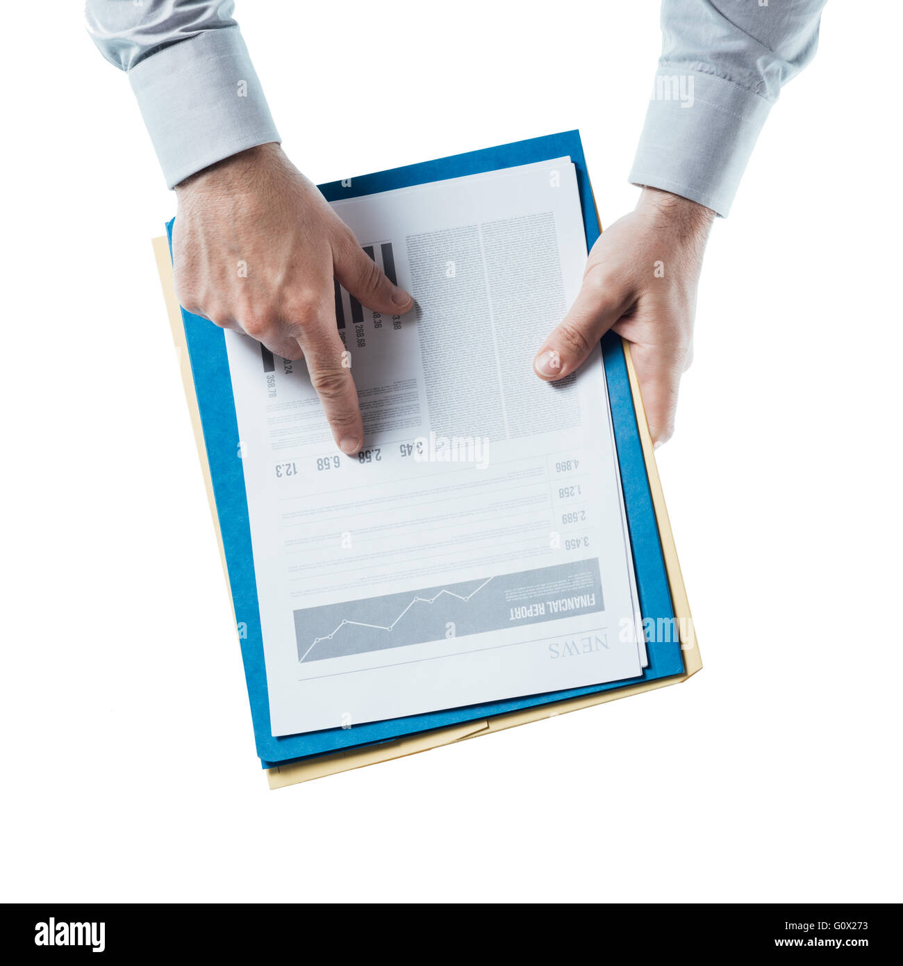 Businessman holding a financial report and pointing at at number, hands close up, top view Stock Photo