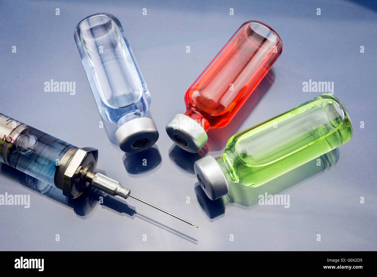 Medicine vials and syringe Stock Photo