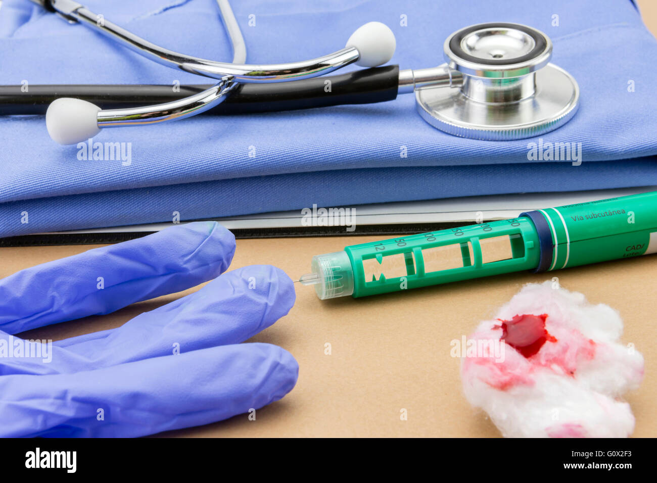 Insulin injecting pen and stethoscope, concept of diabetes Stock Photo