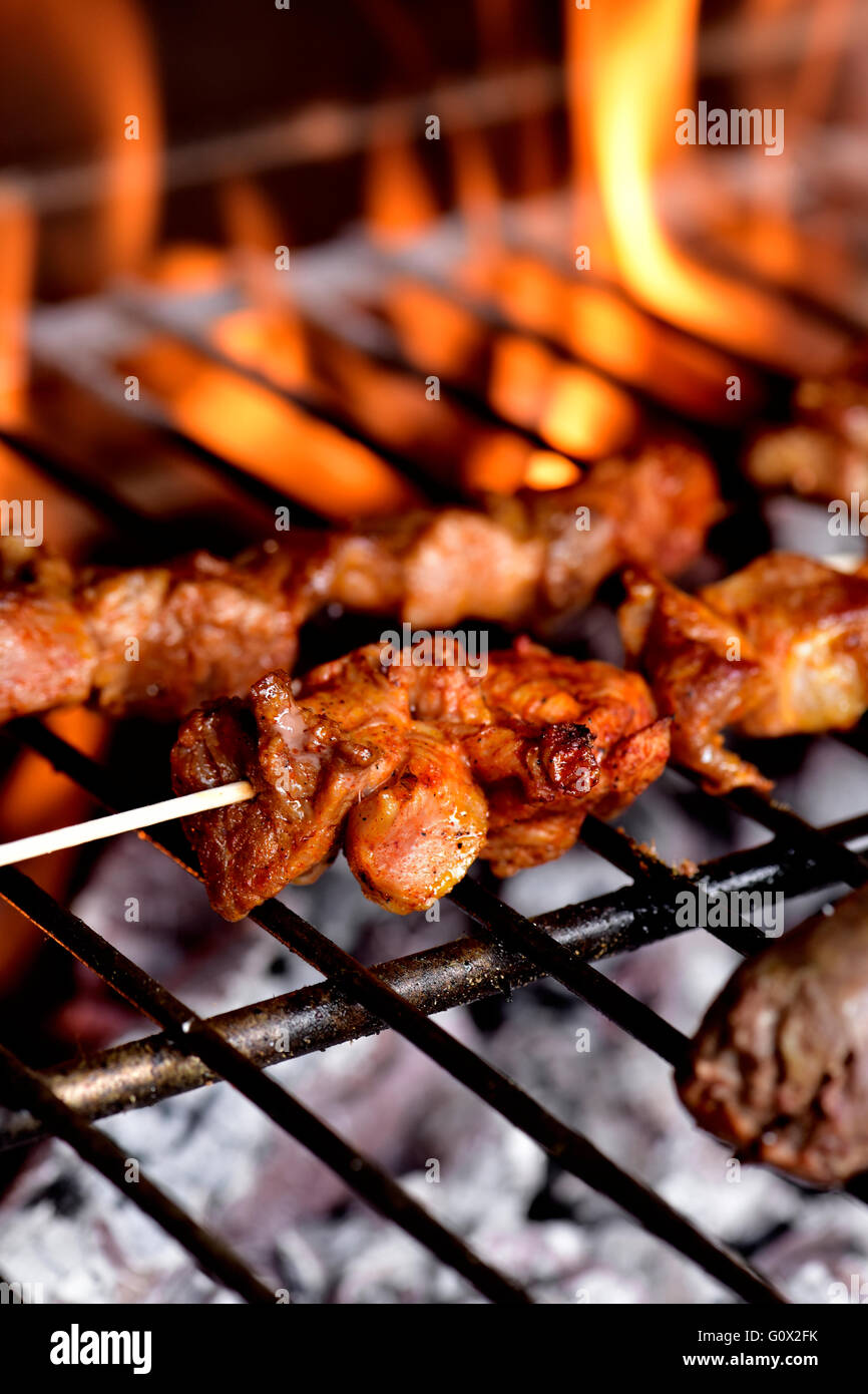 closeup of some meat skewers being grilled in a barbecue Stock Photo ...