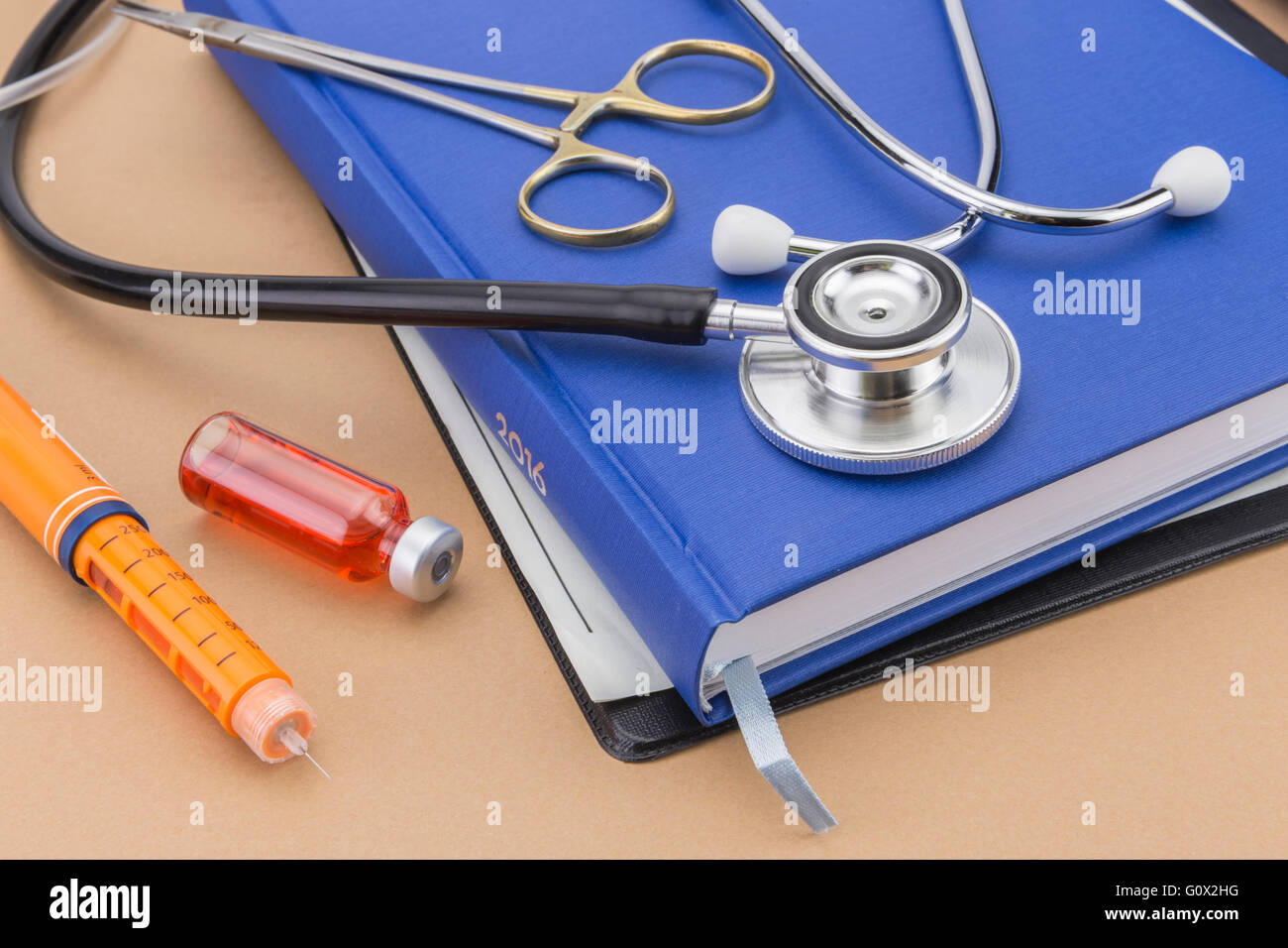 Insulin injecting pen and stethoscope, concept of diabetes Stock Photo