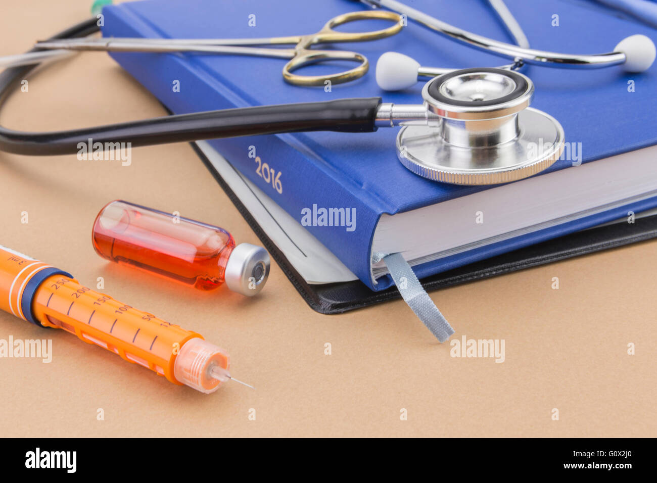 Insulin injecting pen and stethoscope, concept of diabetes Stock Photo