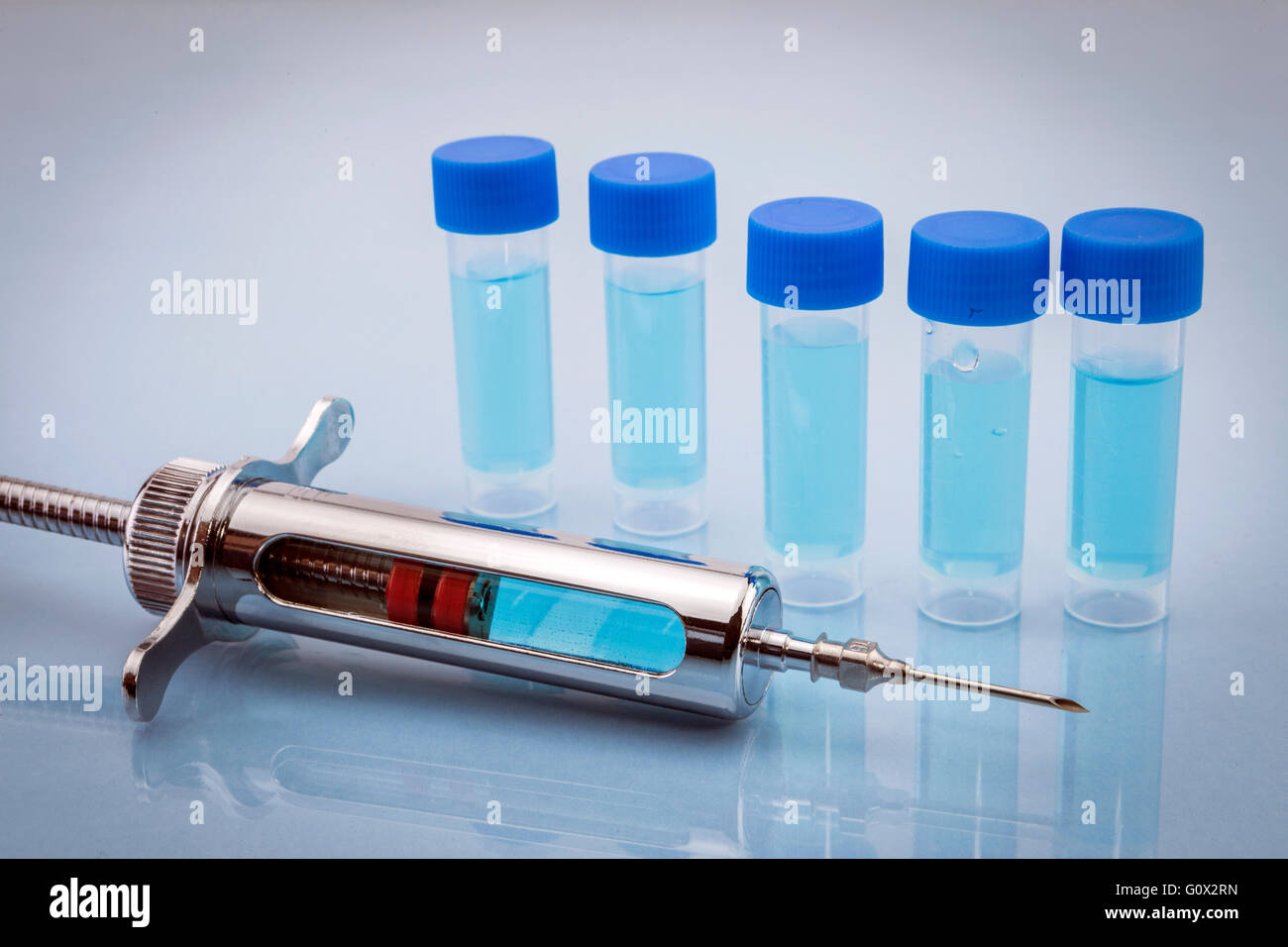 Medicine vials and syringe Stock Photo