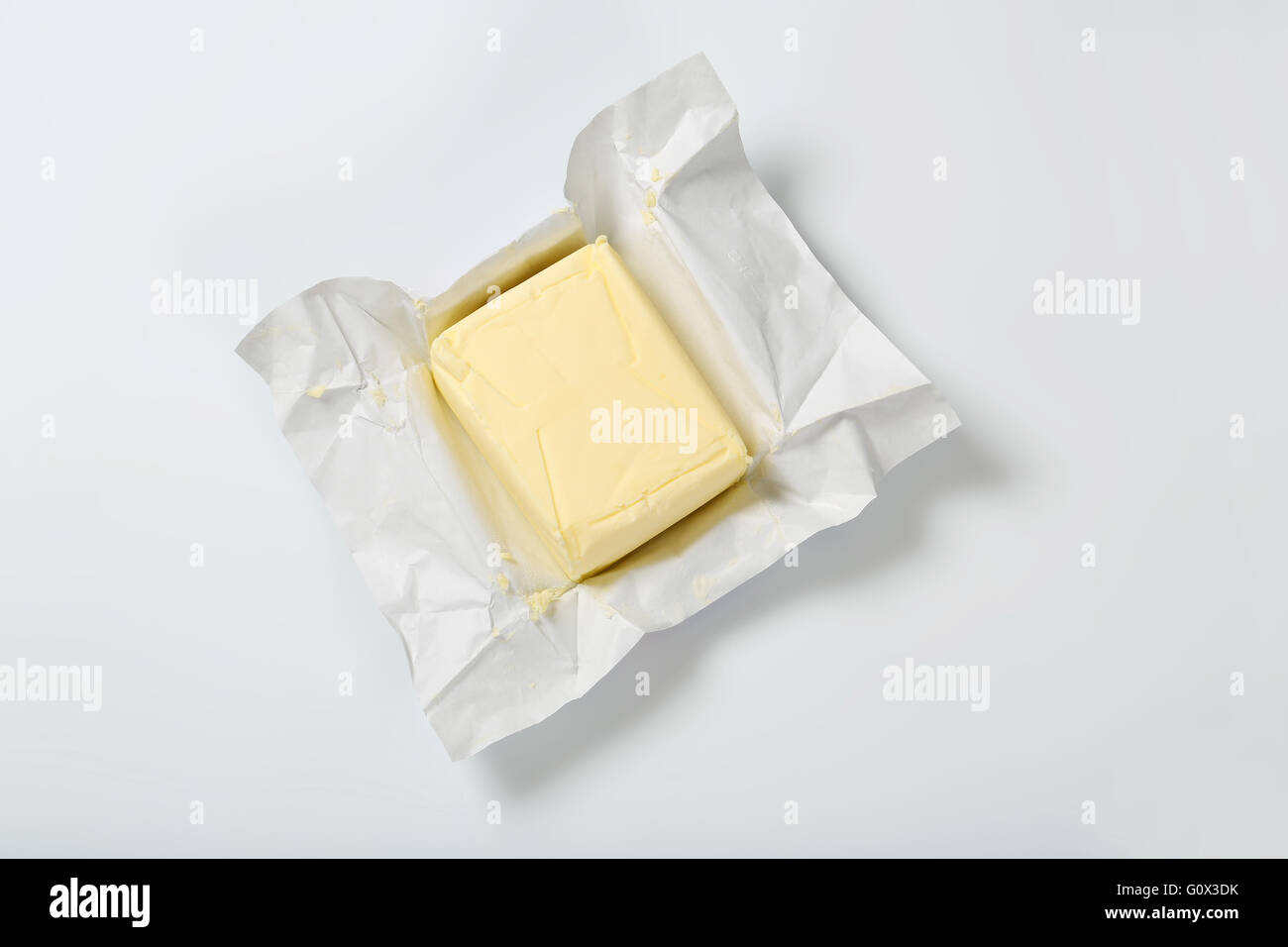 block of fresh butter on white background Stock Photo