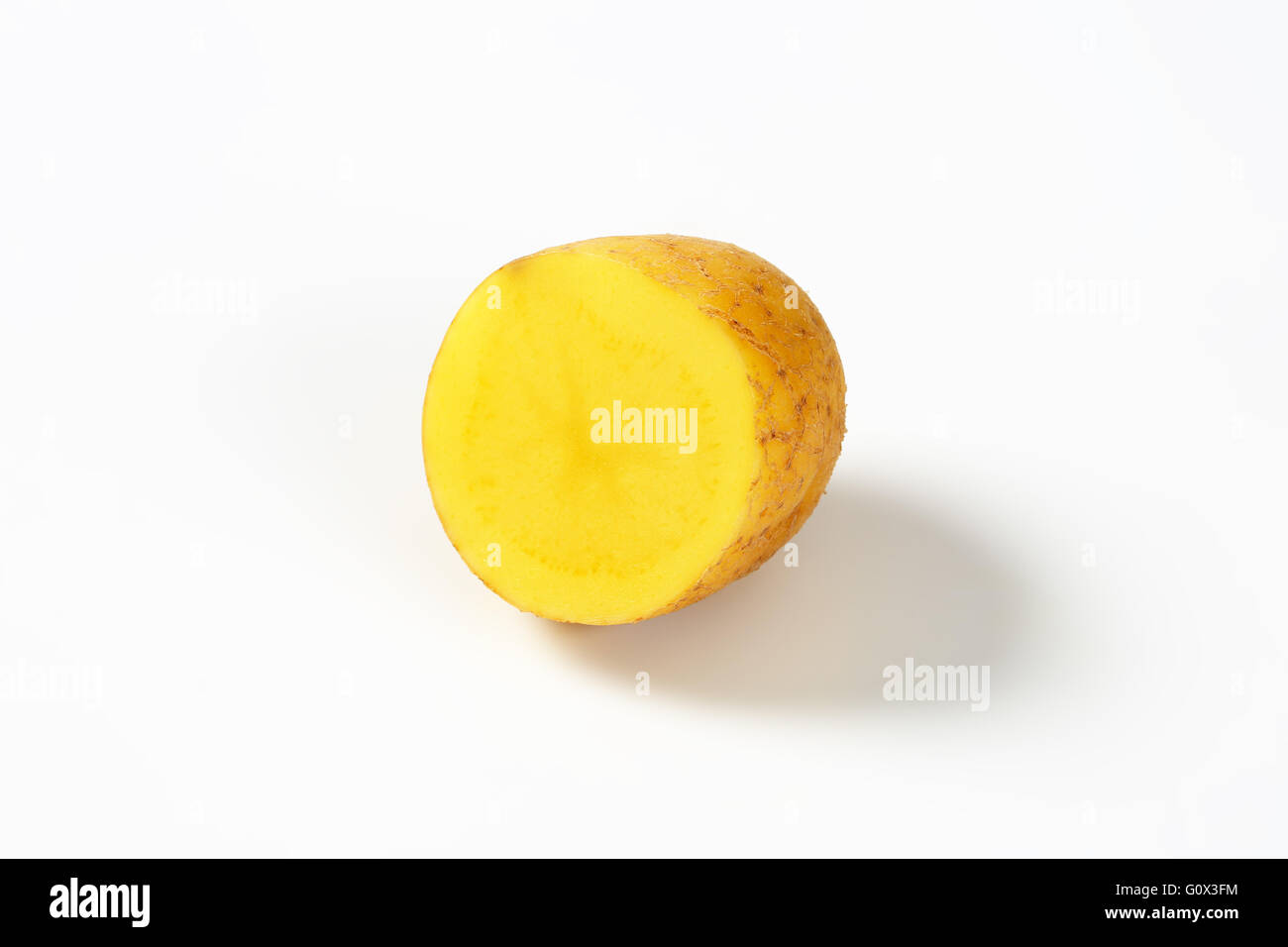 half a raw potato on white background Stock Photo Alamy