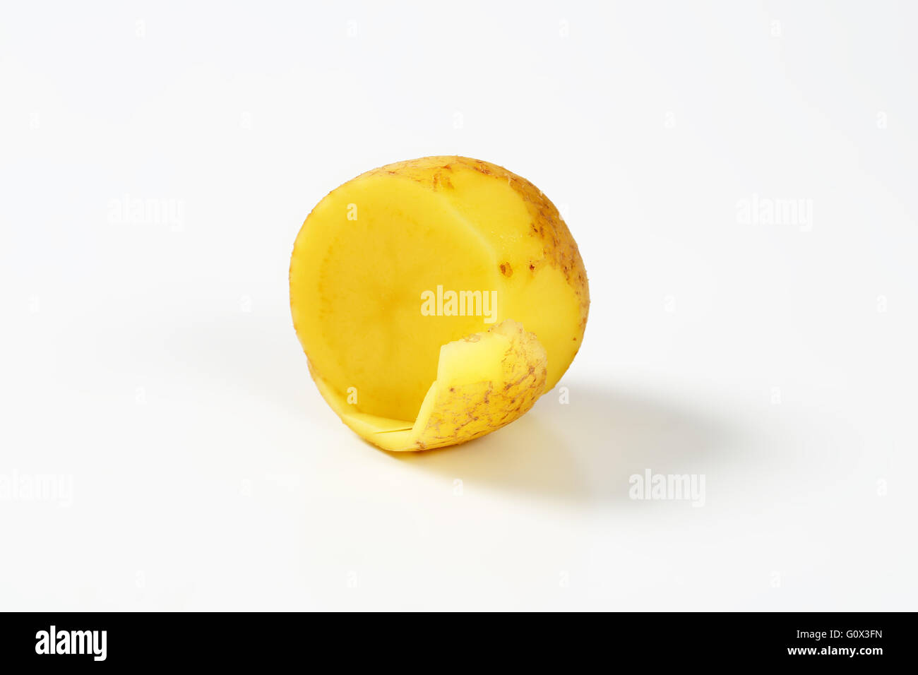 half a raw potato on white background Stock Photo Alamy