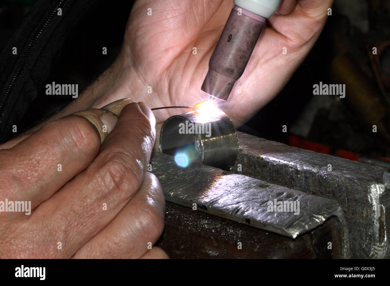 A man TIG welding Stock Photo