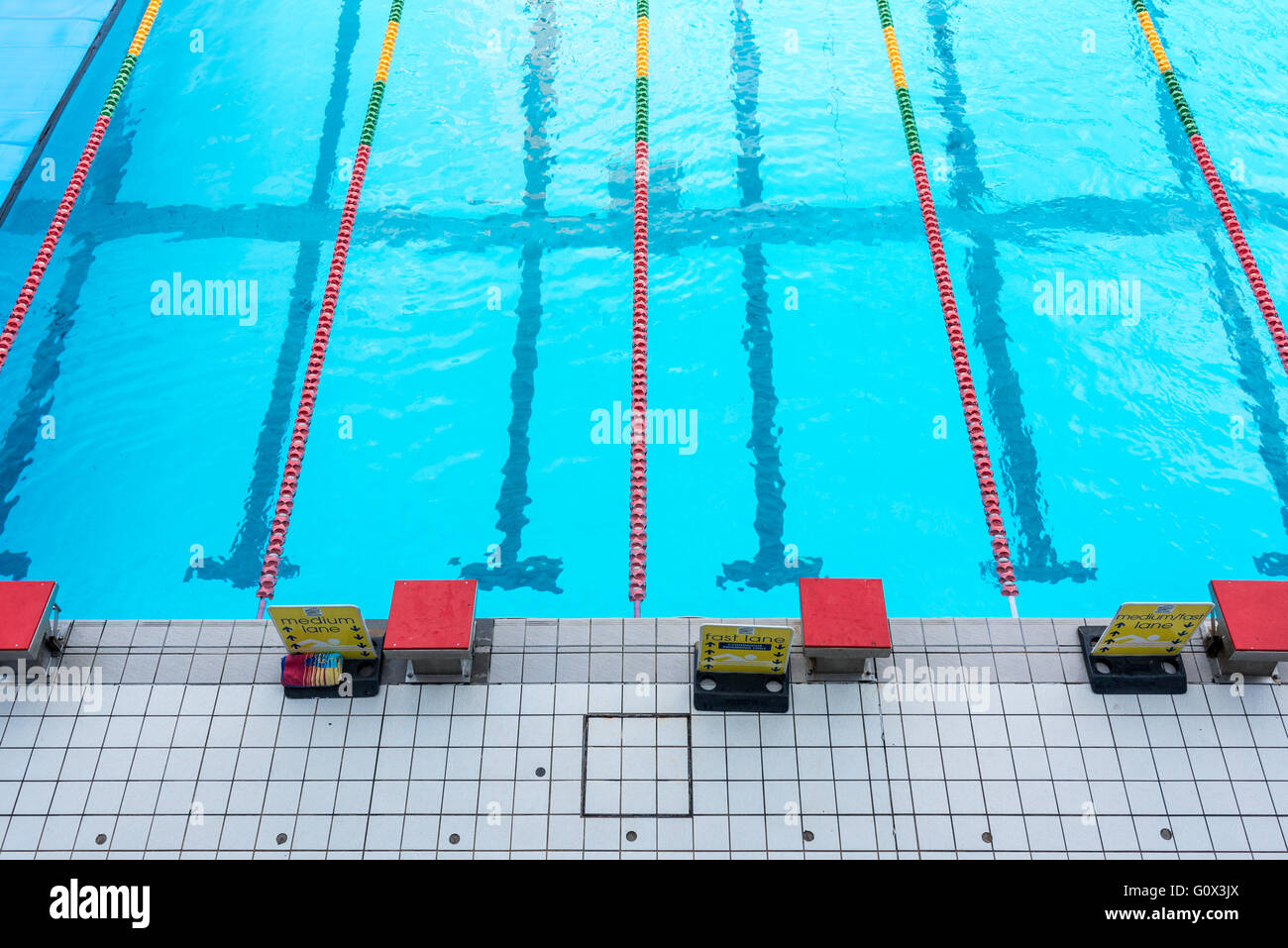 Swimming pool starter blocks Stock Photo