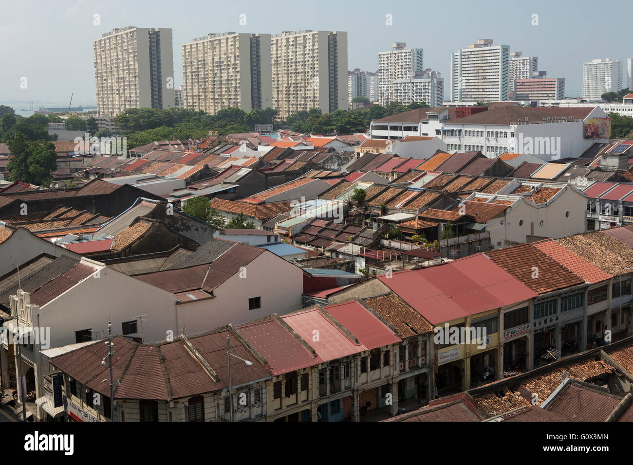 Rooftops of Georgetown Penang. Elevated view of the UNESCO world heritage area. Old shop houses temple with modern flats behind Stock Photo