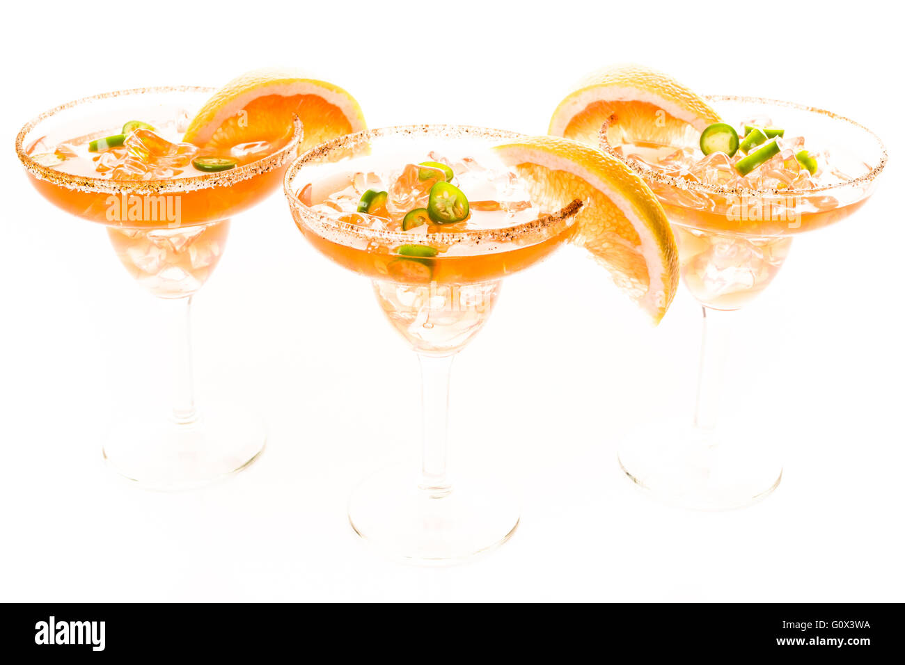 Spicy grapefruit margarita on ice in margarita glasses. Stock Photo
