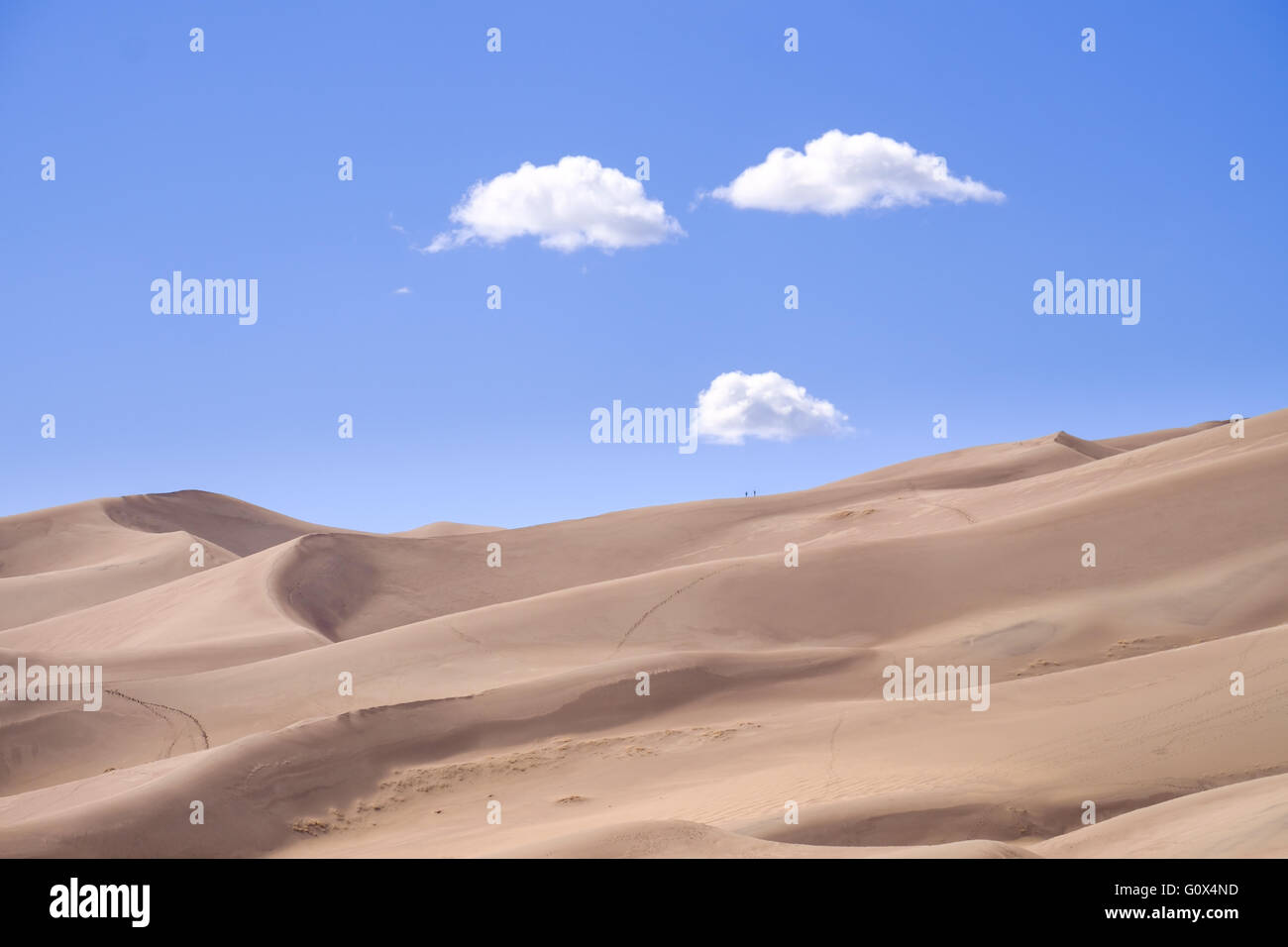 Clouds suggesting a face over Great Sand Dunes national park, Colorado Stock Photo