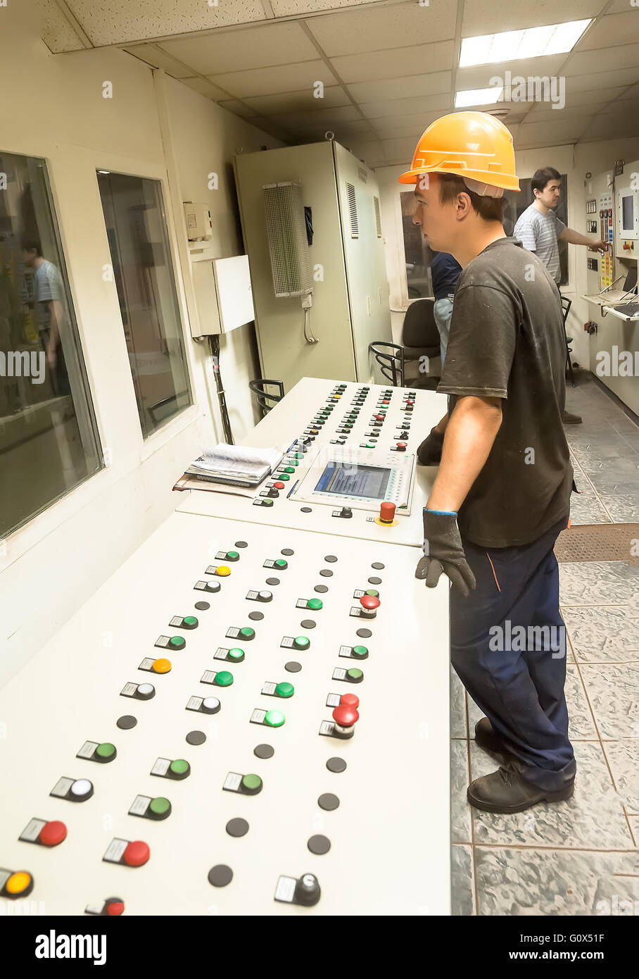Engineers operate production conveyor Stock Photo Alamy