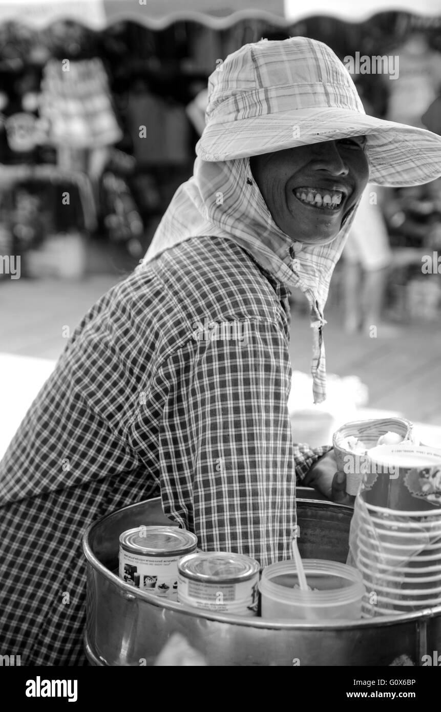 Asian woman selling coconut icecream, thailand. Stock Photo