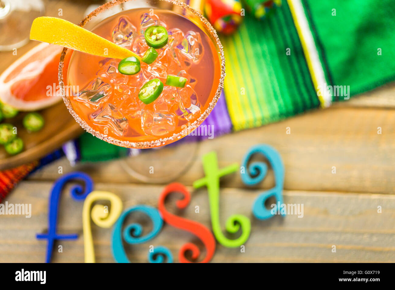 Spicy grapefruit margarita on ice in margarita glasses Stock Photo Alamy