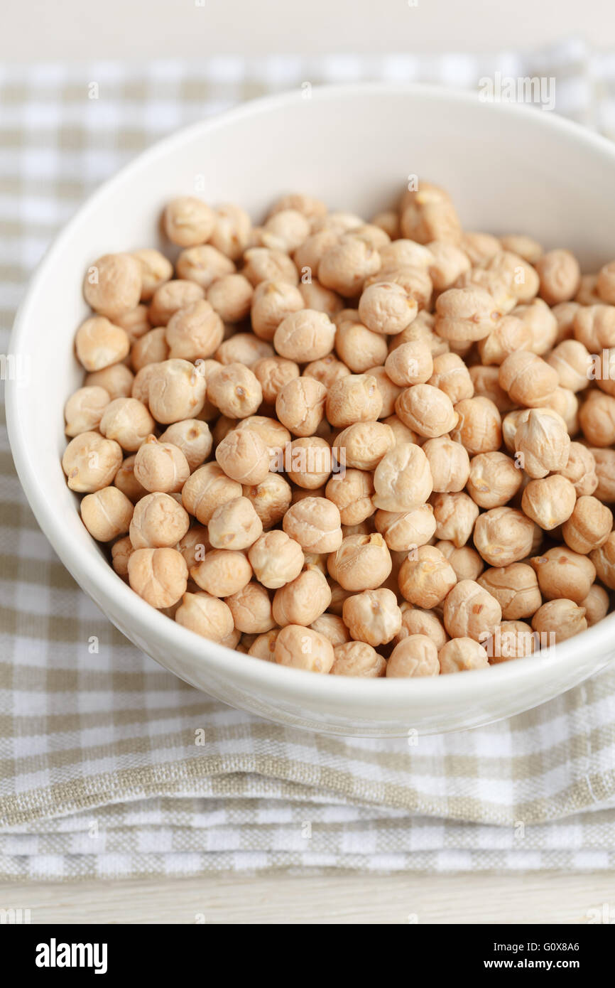 Dried chickpeas in a white bowl Stock Photo