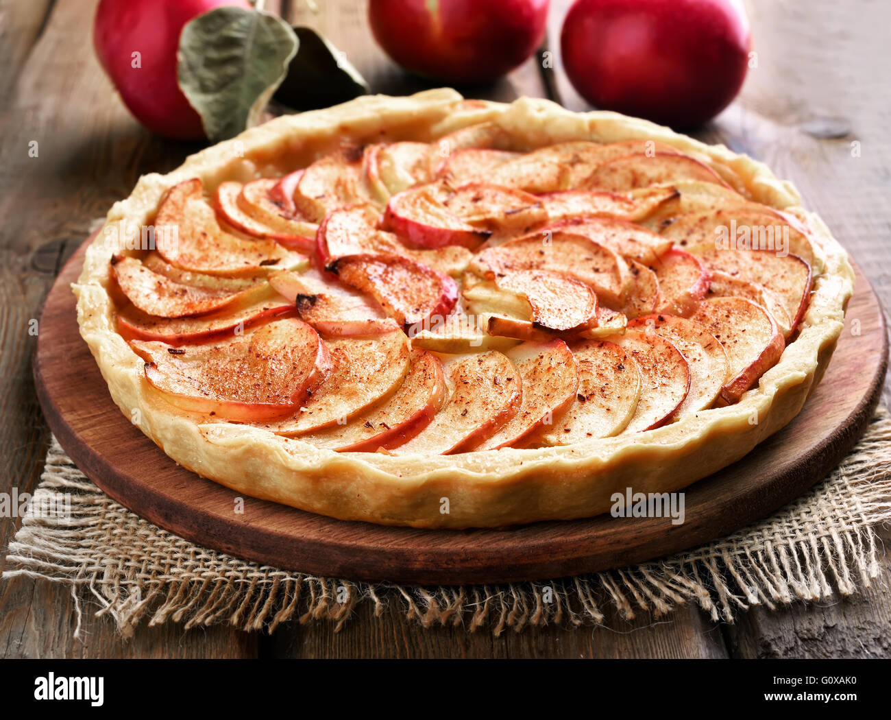 Fruit baking apple pie on wooden table Stock Photo