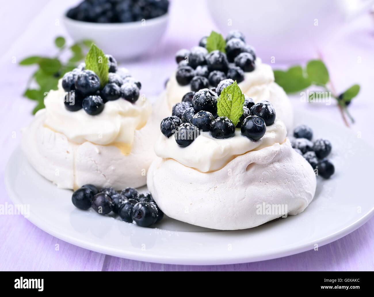 Pavlova meringue cakes with fresh blueberries Stock Photo Alamy
