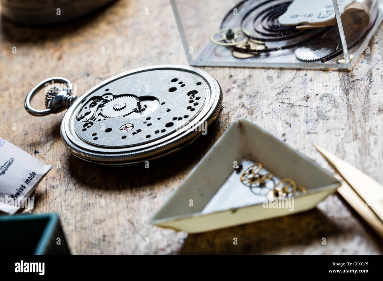 closeup of pocket watch mechanism and clockworks on the table of a clockmaker Stock Photo