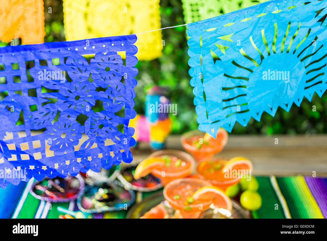 Picado banner over the table at the garden party. Stock Photo