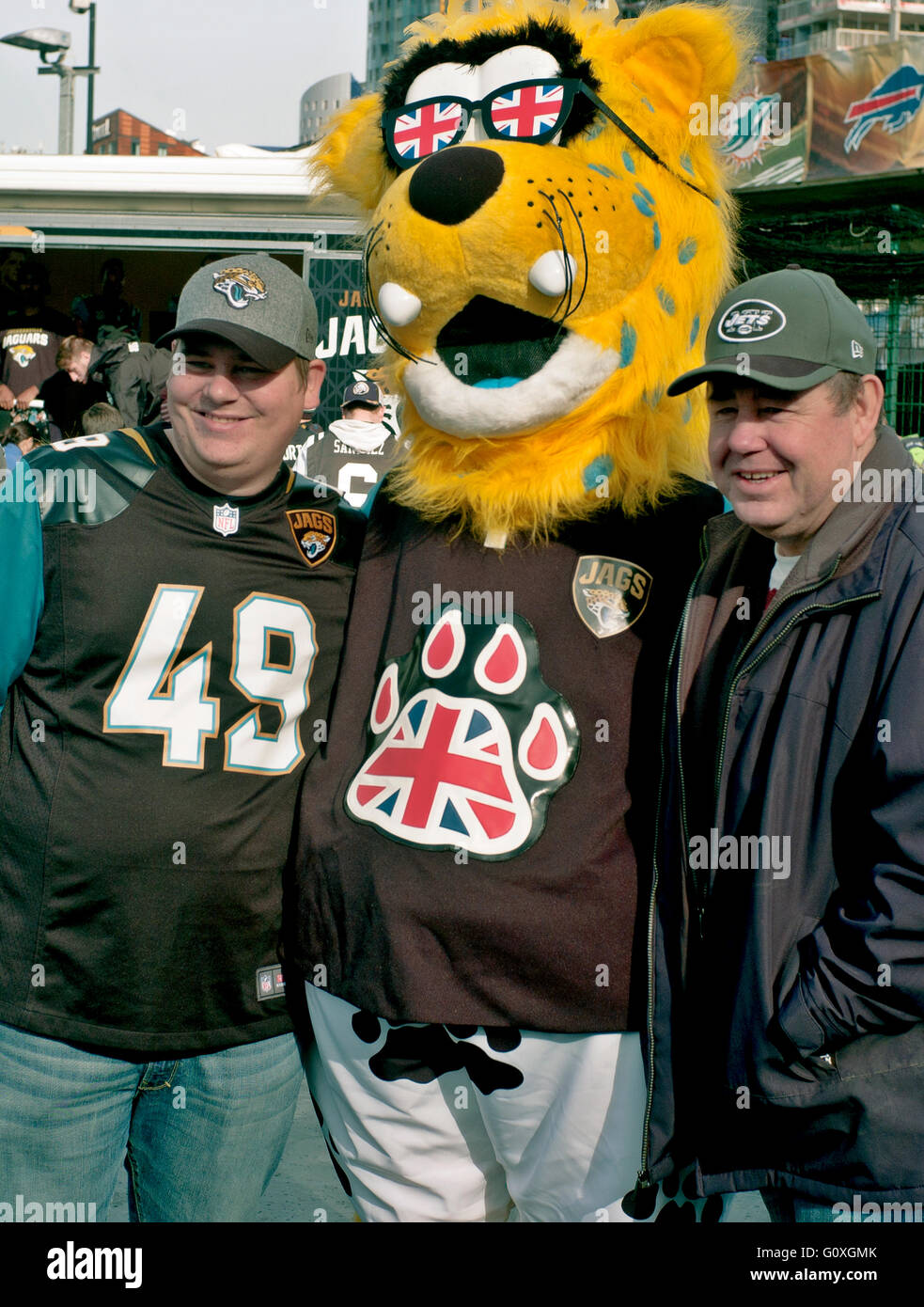 jaxson de ville the mascot of the jacksonville jaguars with two fans